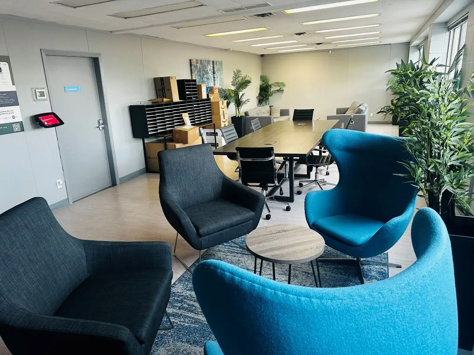 Modern office with seating and conference table.